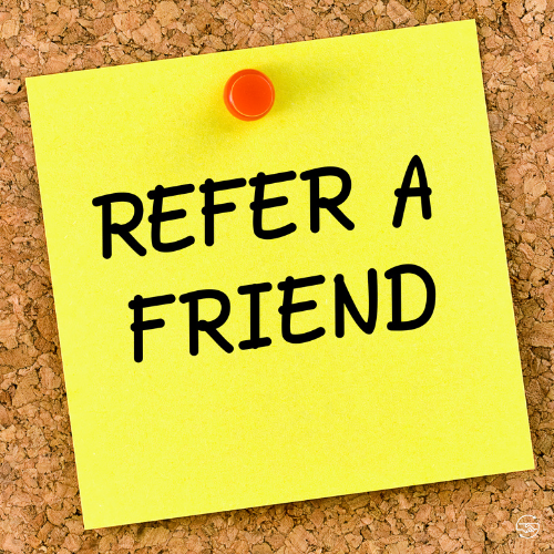 Refer a friend written on a post it note pinned to a cork board